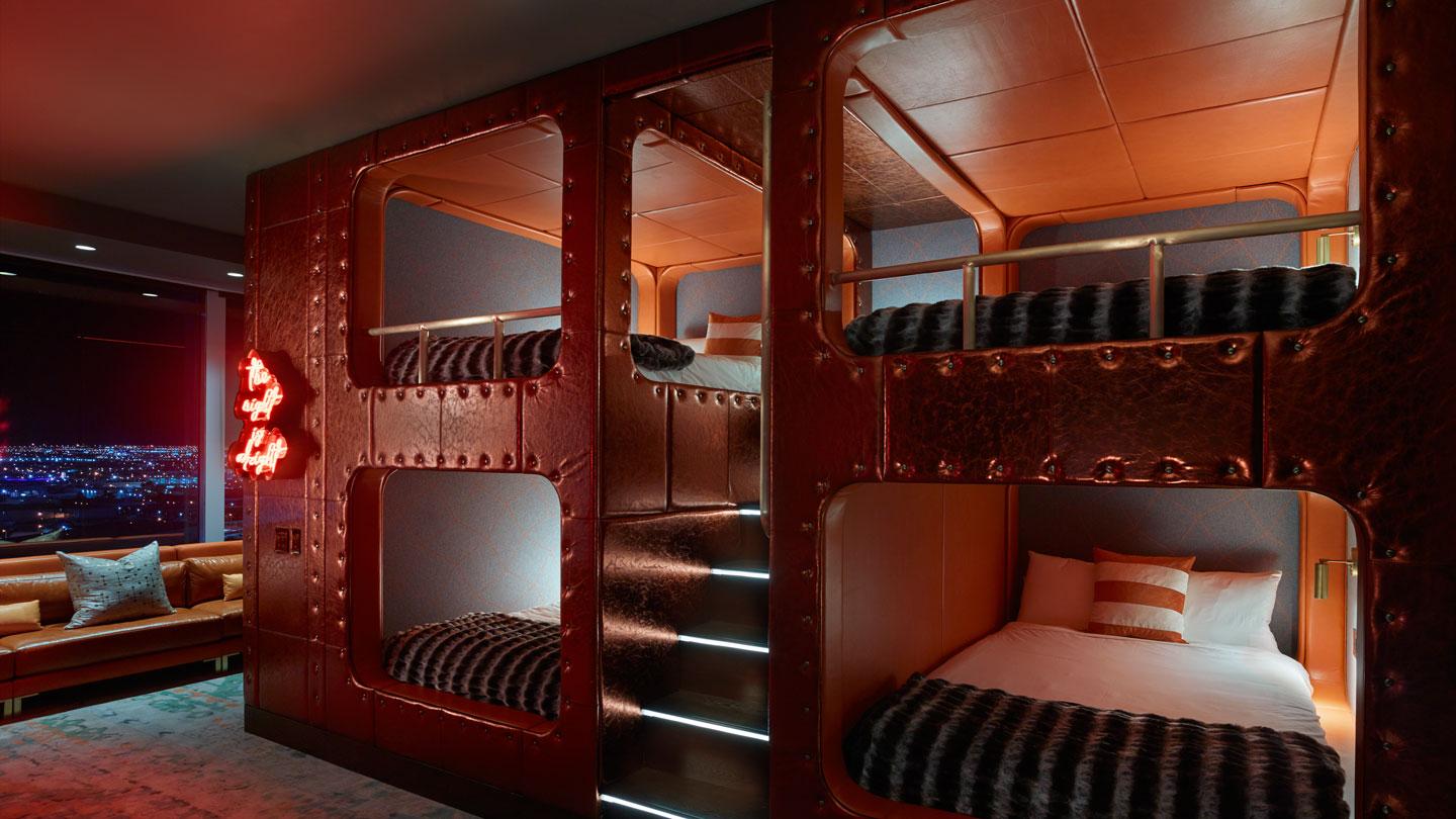 Two sets of double queen bunk beds and custom millwork invite the ultimate sleepover experience. 