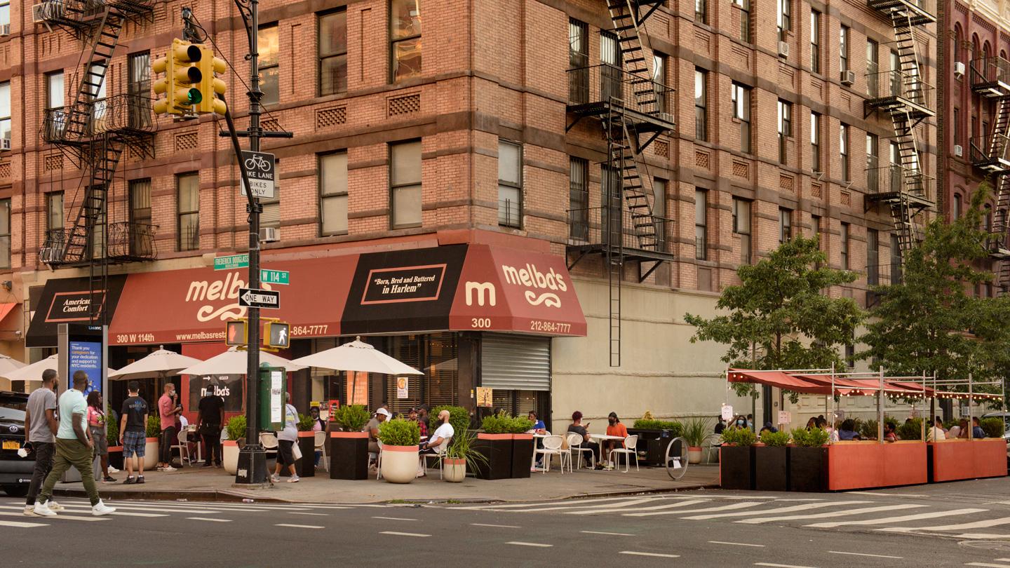 Street view of DineOut NYC and Melba's restaurant in Harlem