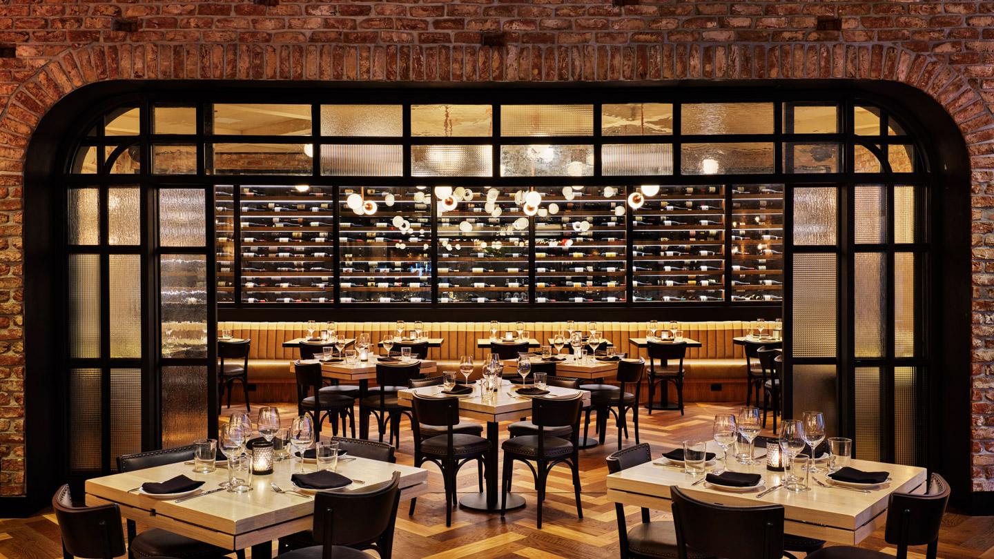 Main dining room and wine rack at CATCH Steak designed by Rockwell Group architects in New York City