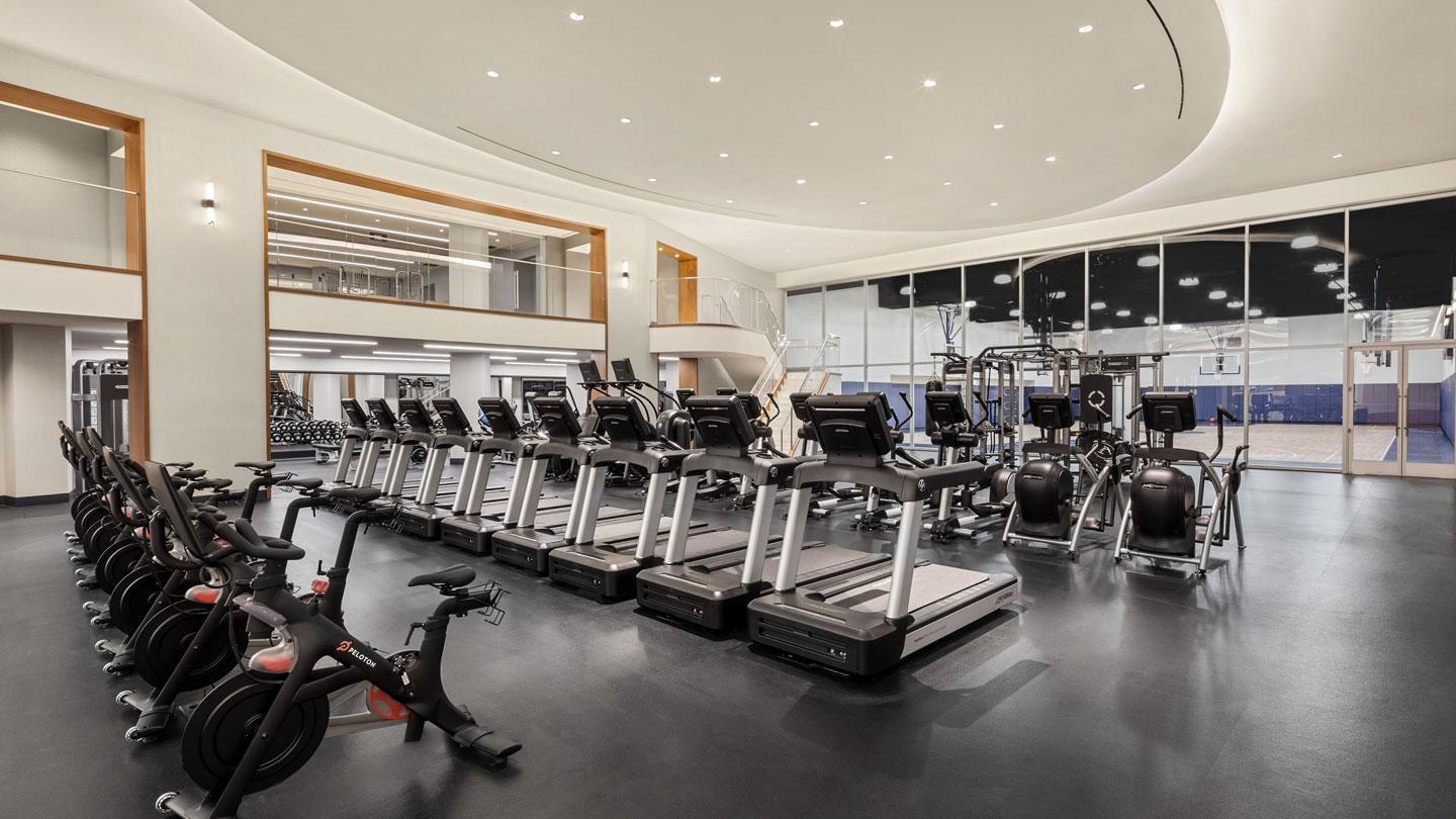 Gym with treadmills and bikes at the Waterline Club designed by Rockwell Group