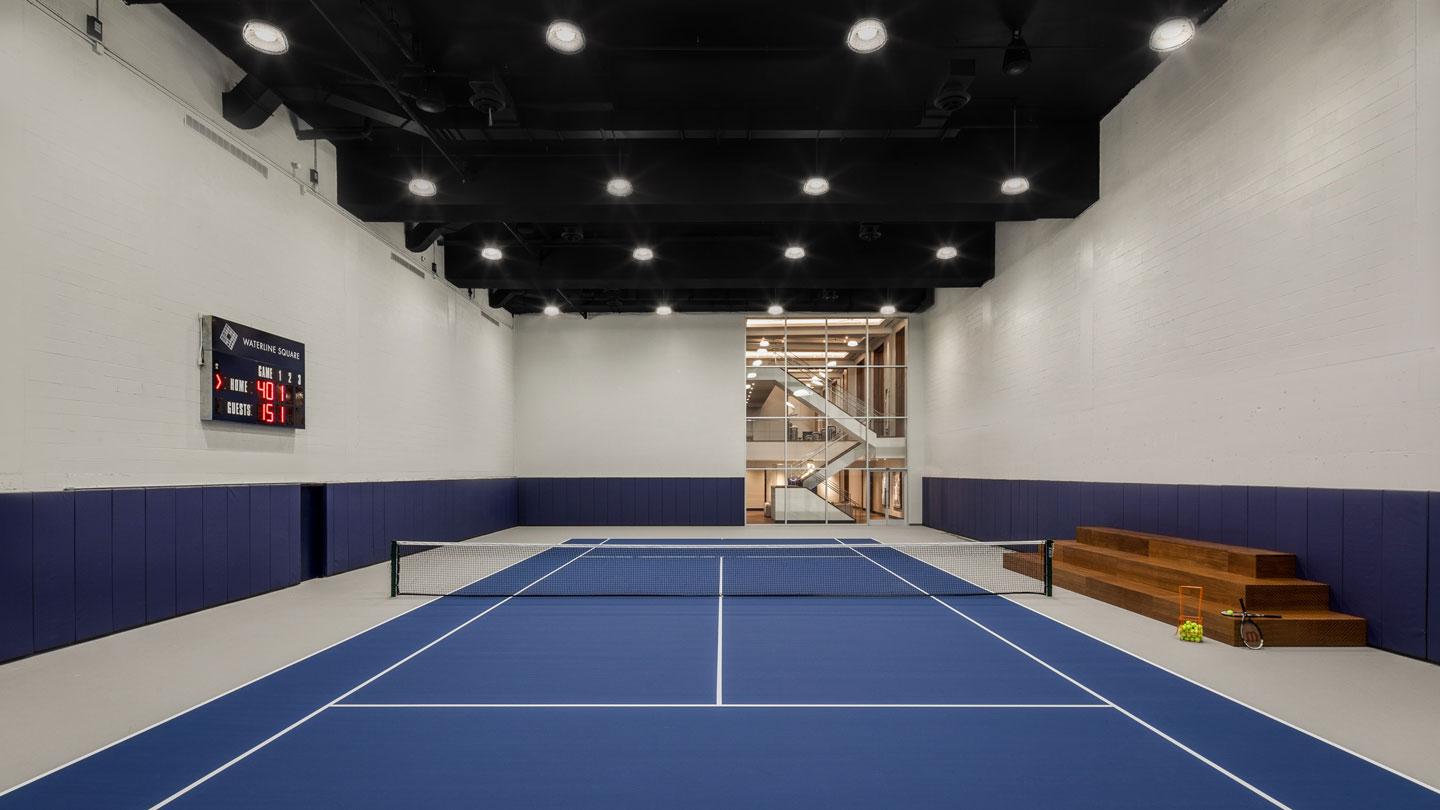 Blue tennis court at Waterline Club designed by Rockwell Group