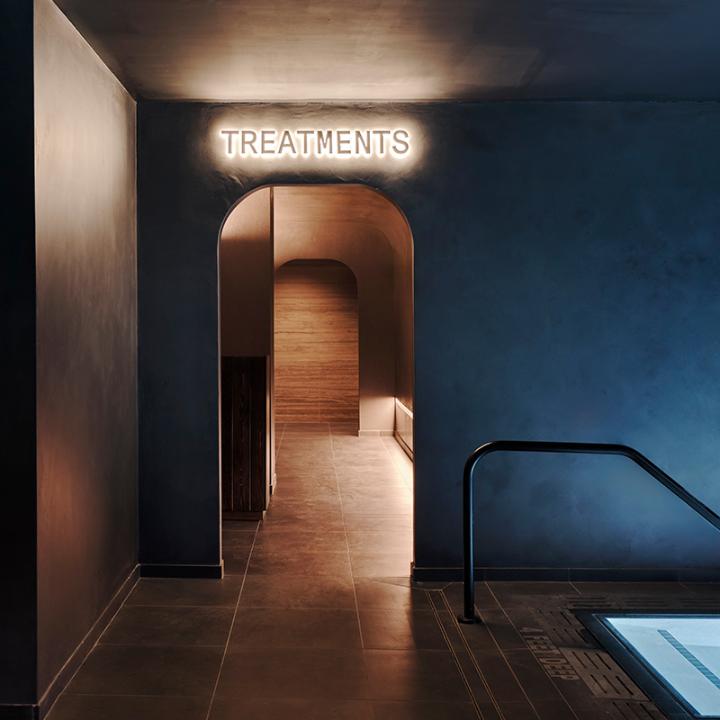entry to bathhouse's spa treatment corridor with steps leading to pool, flatiron, nyc, spa design