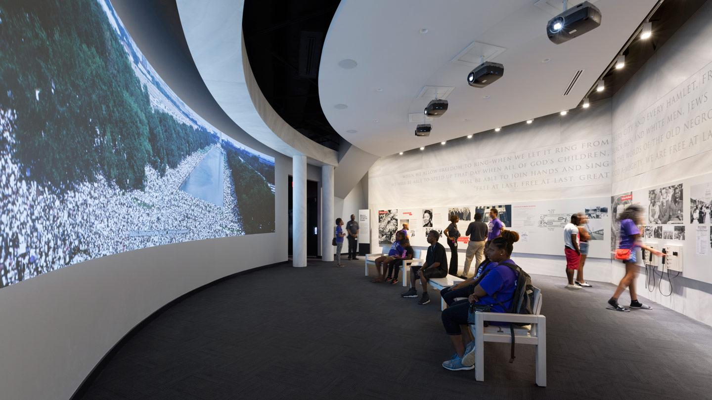 people watching film in museum exhibit at the center for civil and human rights in atlanta 