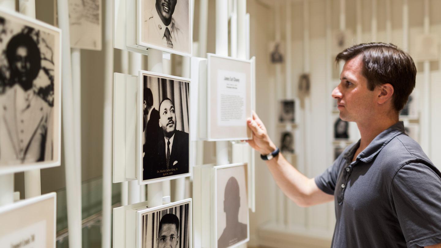 person viewing portrait of dr. martin luther king jr 