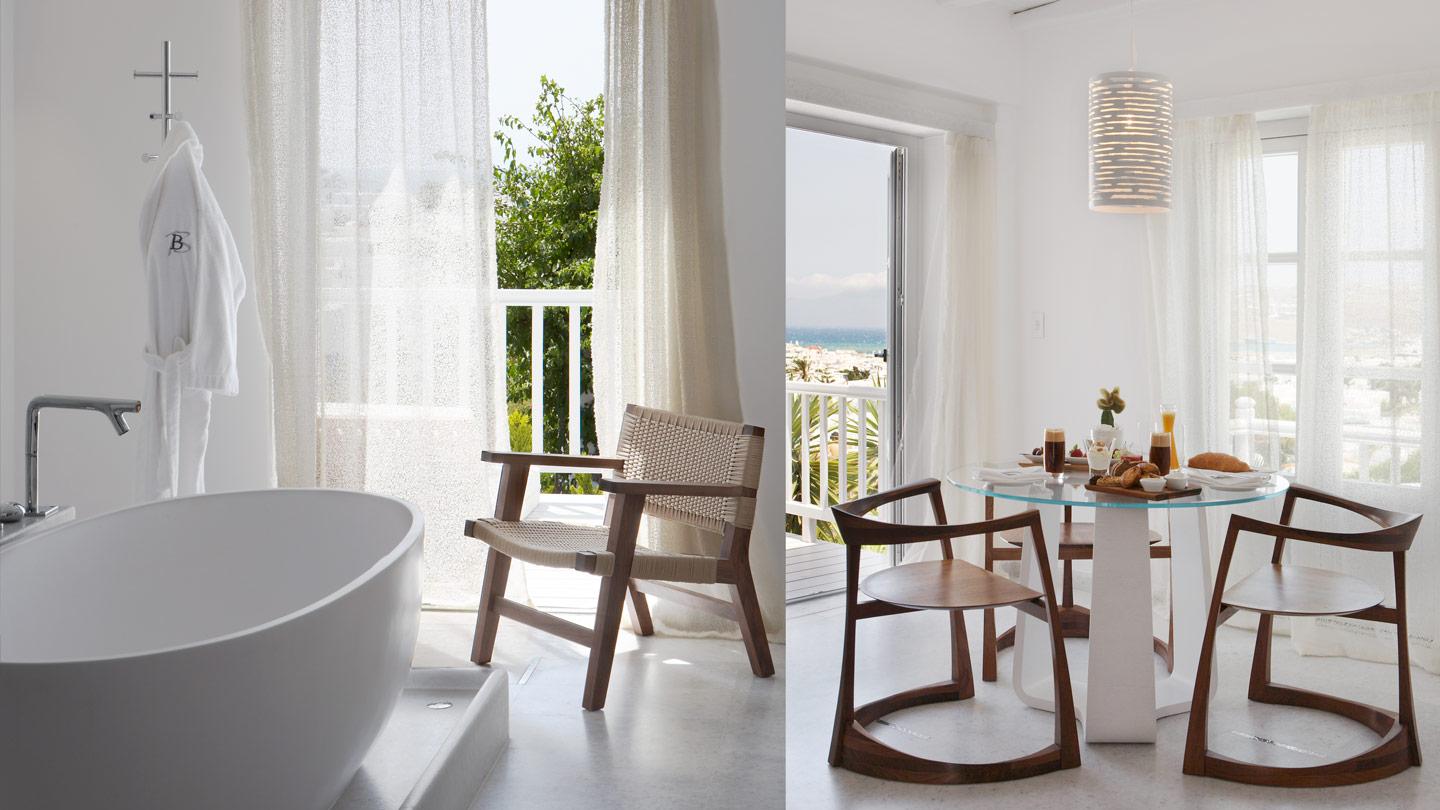 freestanding bathtub and dining area in guestrooms at belvedere hotel in mykonos greece
