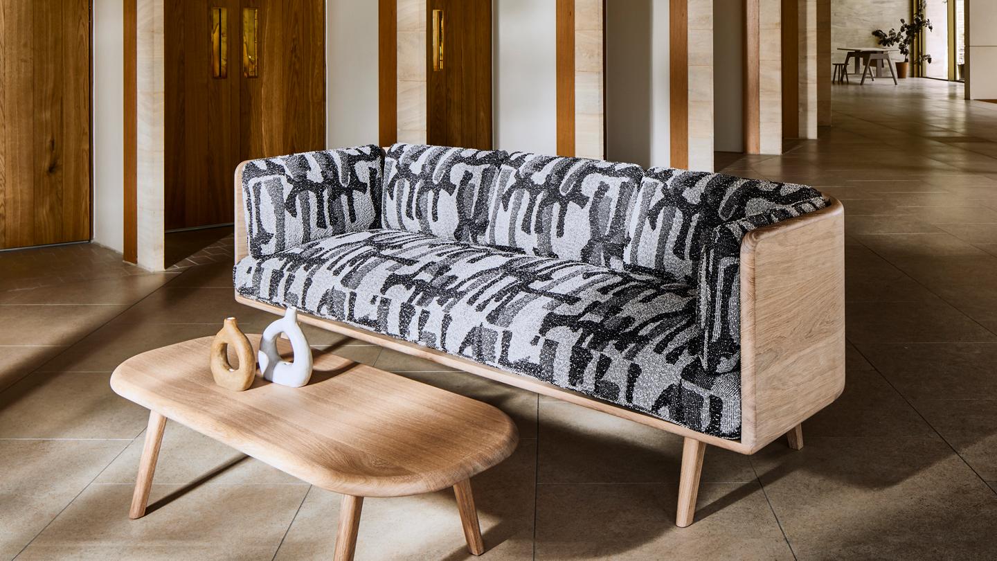 Subtle yet complex in detail, the sofa exemplifies Benchmark’s skilled woodworking.