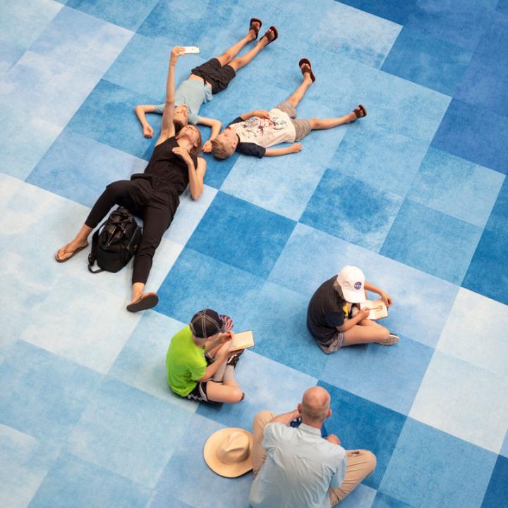 A pixelated blue carpet manufactured by Shaw for Rockwell Group's Lawn installation