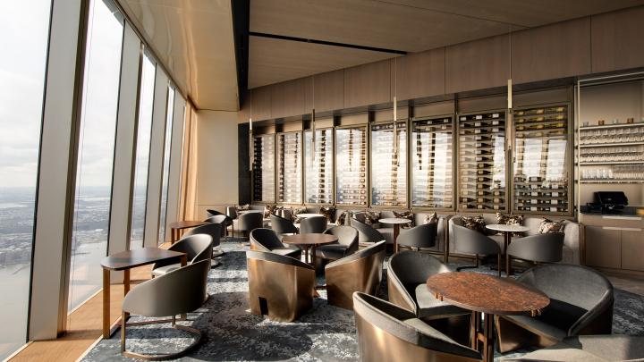 Lounge and wine rack at Peak restaurant designed by Rockwell Group at Hudson Yards