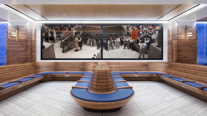 curved banquettes and artwork by stan smith at amtrak waiting room in moynihan train hall, nyc